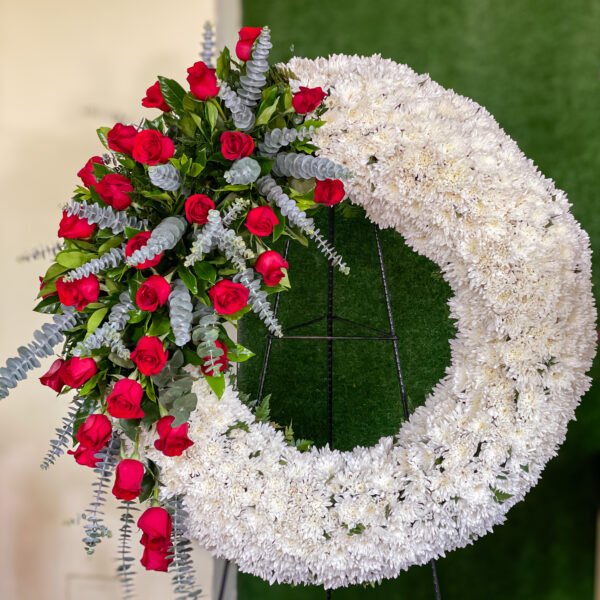 Corona fúnebre con rosas